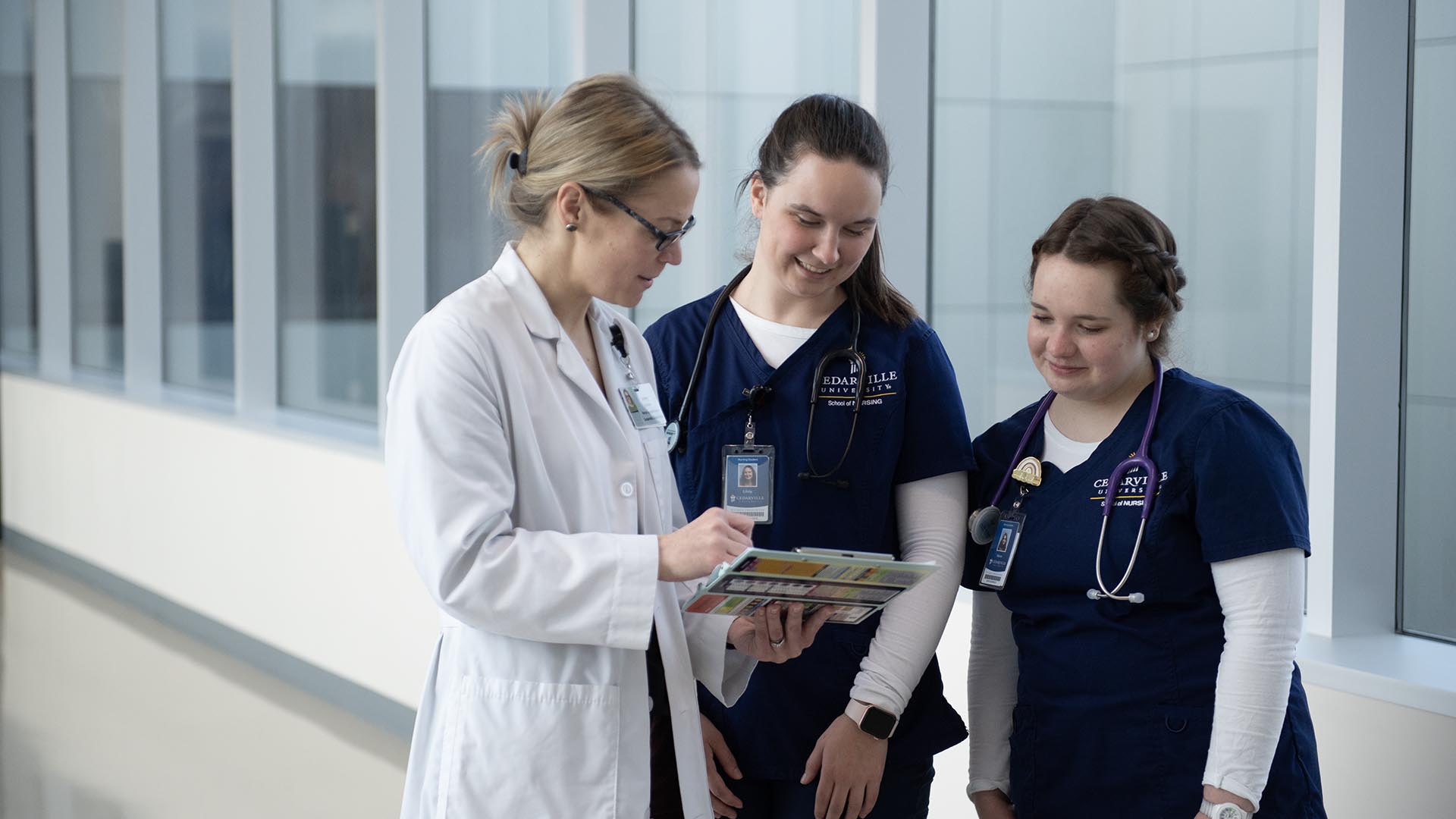 nursing instructor with nursing students during clinical rotation