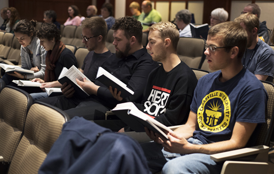 students participate in hymn sing