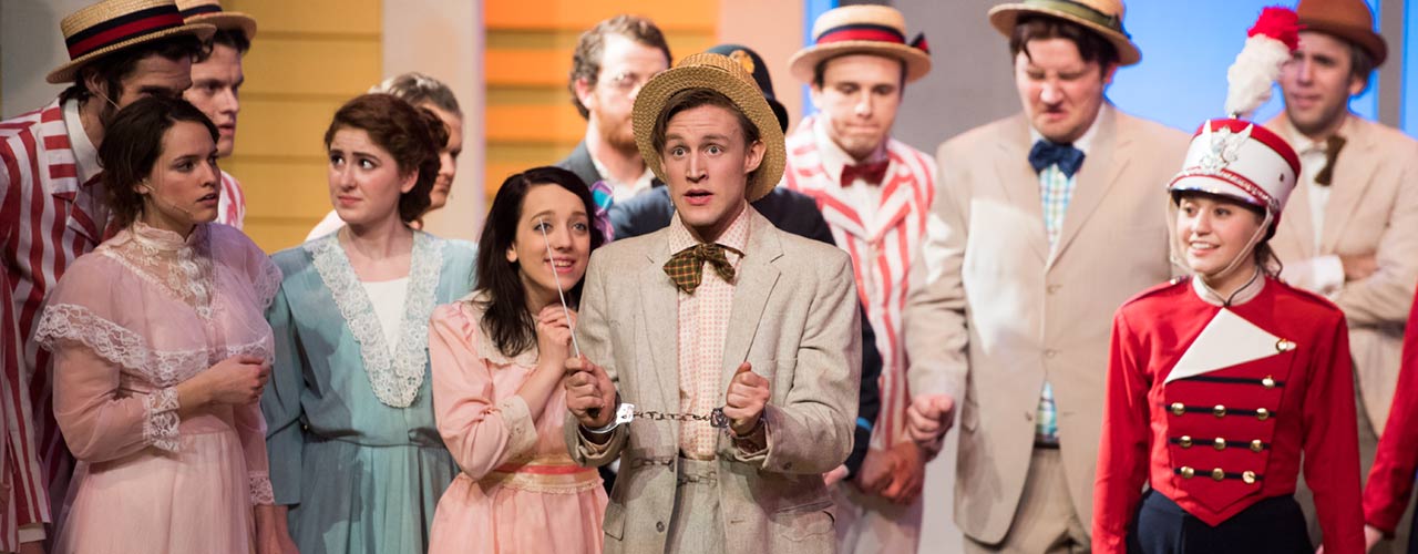 Members of the Music Man cast perform on stage