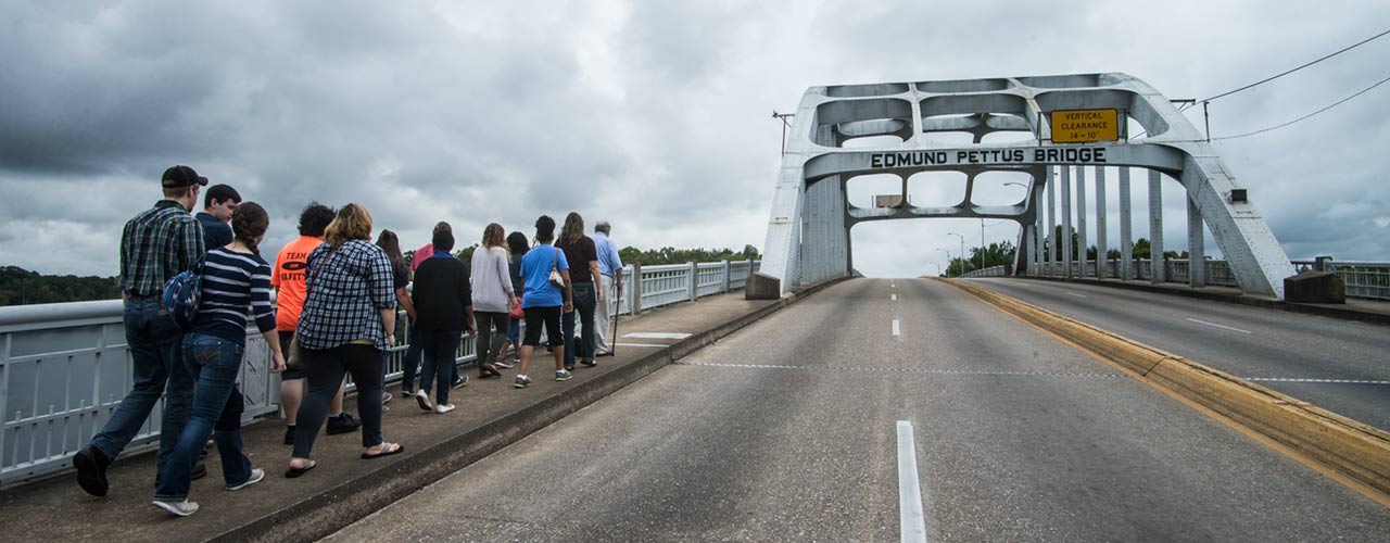A group from Cedarville University walks across the Edmund Pettus Bridge in Selma, Alabama.