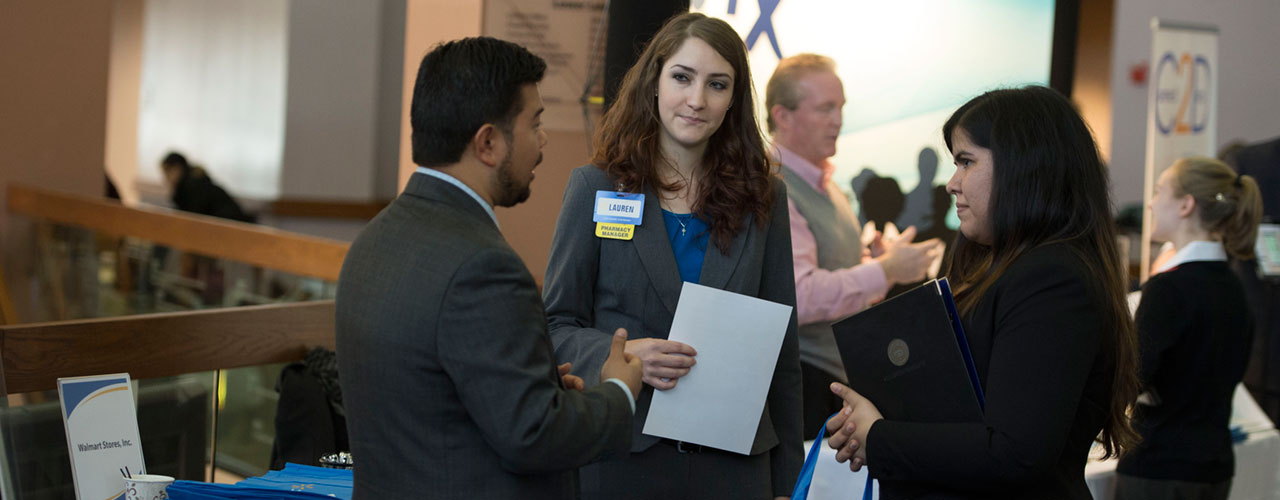 Pharm.D. students talk with a recruiter.