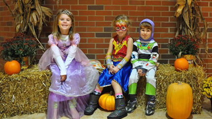 Children show off their costumes during the annual Halloween parade hosted by the Cedarville University bookstore