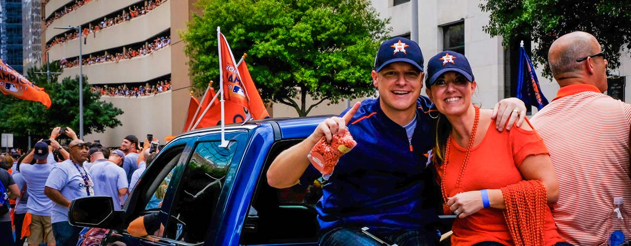 Jason Howard and his wife in the Astros World Series parade.