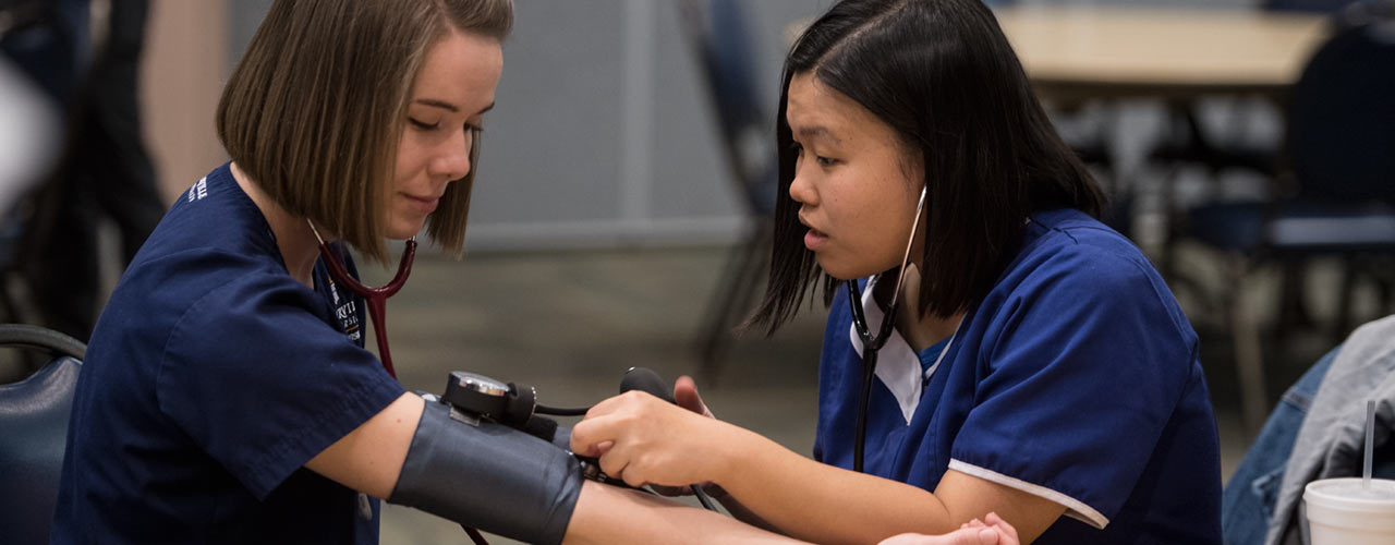 Cedarville nursing student takes blood pressure reading