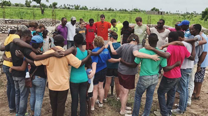 Haiti Mission team prays in circle