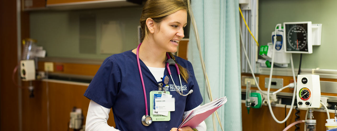 Nursing student talks to off-camera patient
