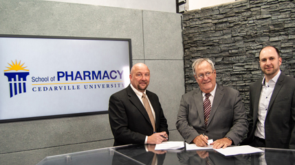 Dr. Marc Sweeney, Dr. Ernie Boyd, and Dr. Justin Cole signing the memorandum of understanding between the Ohio Pharmacists Association and Cedarville's Center for Pharmacy Innovation.