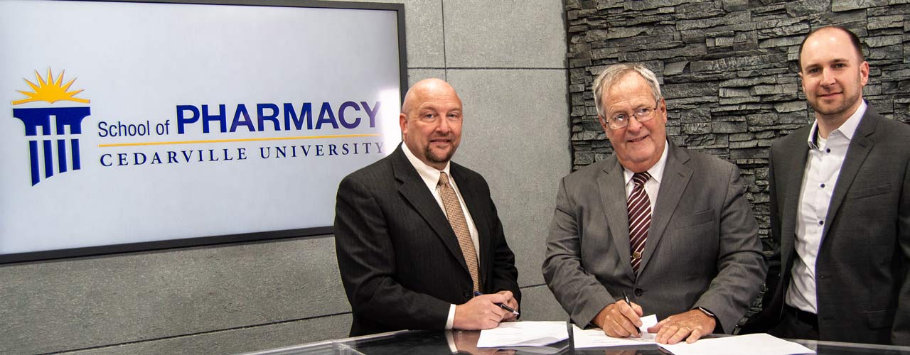 Dr. Marc Sweeney, Dr. Ernie Boyd, and Dr. Justin Cole signing the memorandum of understanding between the Ohio Pharmacists Association and Cedarville's Center for Pharmacy Innovation.