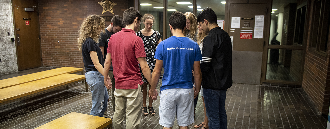 Cedarville University students praying in the lobby at the Clark County Jail in Springfield, Ohio.