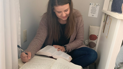 Abigail Blain working on her devotional