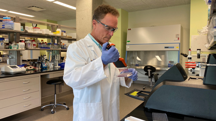 Dr. Rocco Rotello working in a lab
