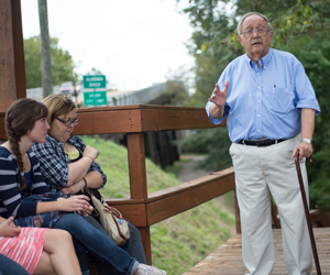Dr. Murray Murdoch talking to students on the Civil Rights Bus Tour near the Edmund Pettus Bridge