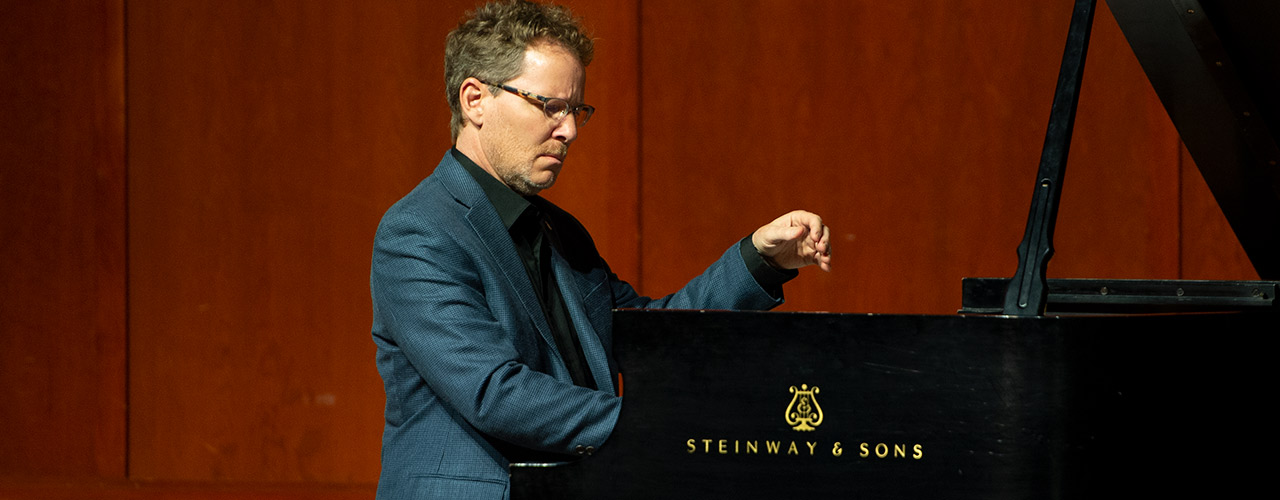 Dr. John Mortensen playing a Steinway piano