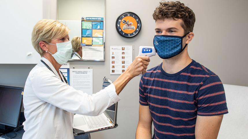 Nurse taking student's temperature at UMS
