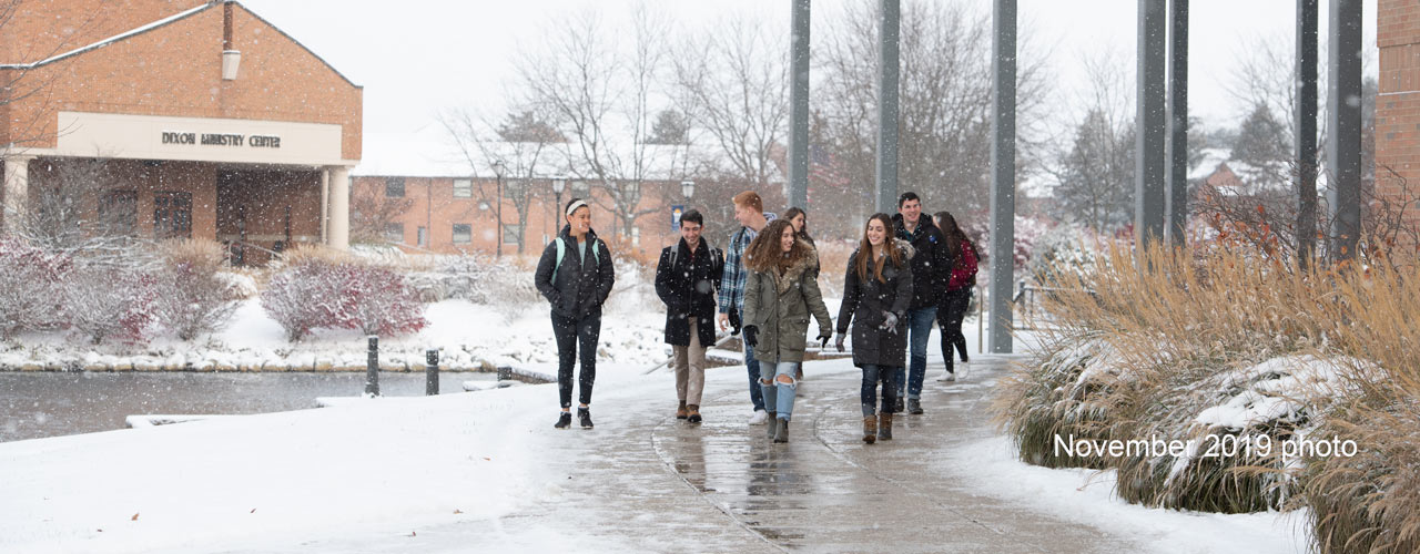 Students walking past the BTS with snow on the ground