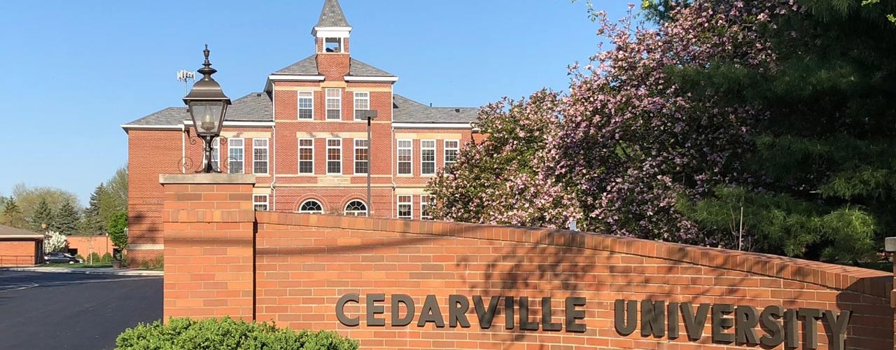 Founders Hall with Cedarville University sign in foreground