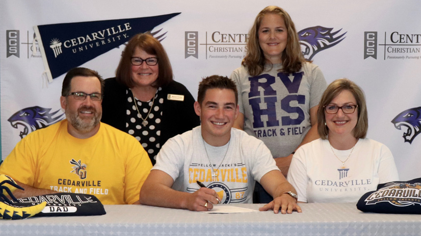 Shaun, Luke, and Diane Hannay (front row) at Luke's signing for Cedarville