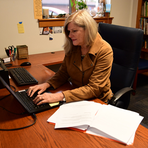 Dr. Ruth Sylvester working at her desk