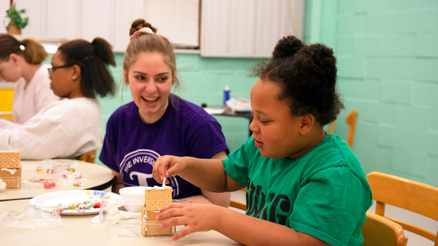 Cedarville female student laughing and talking with girl