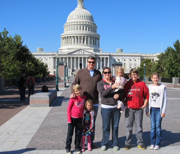 Dr. Mark Caleb Smith, his wife, Denise, and their kids in front of the Capitol in Washington, D.C.