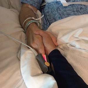 Dr. Michael McKay and his wife, Lee-Ann, hold hands after the surgery