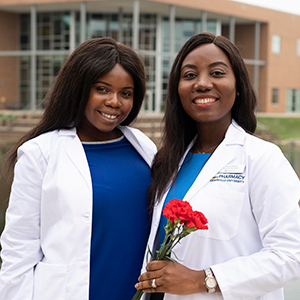 Two students after the white coat ceremony in 2019