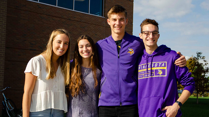 Two female students and two male students recognize Wear Purple Day 2020