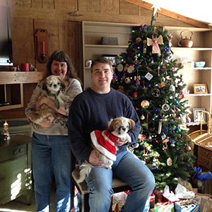 Professor Julie Deardorff and Dr. Don Deardorff with their two dogs at Christmas.