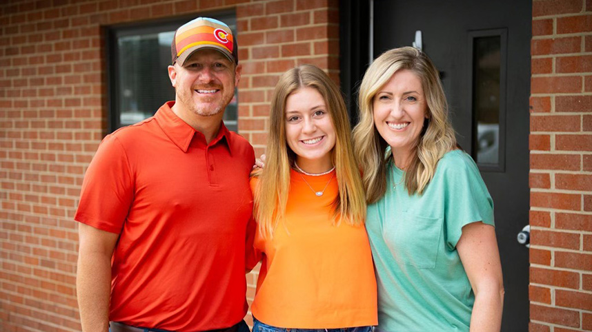 Nearly 20 years since they lived in Printy Hall as residence directors, the Atwells smile with their daughter, Kylie, who is currently living in Printy Hall for the second time, now as an undergraduate student.