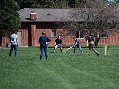 Dr. Glen Duerr plays in the cricket match for his class