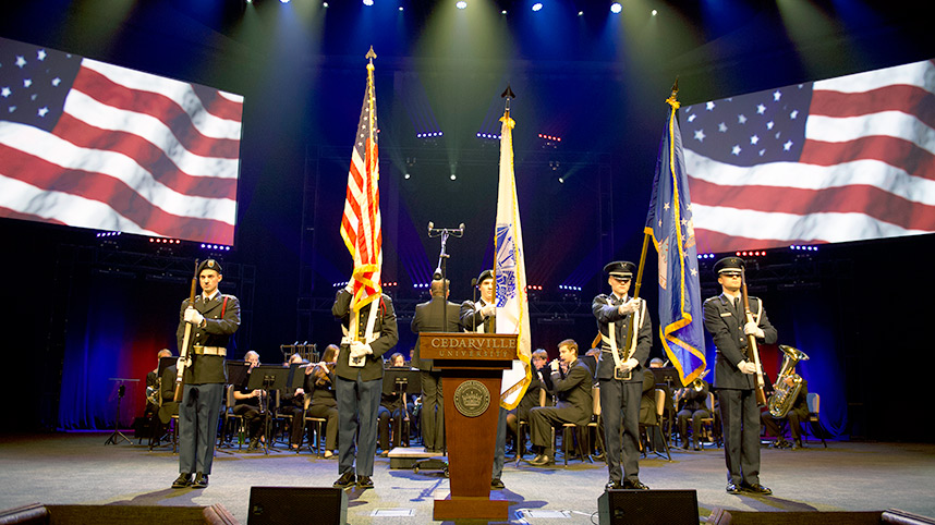 Military honor guard at a past Veterans Day chapel.