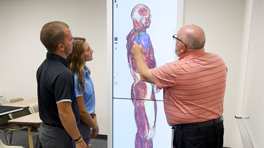 Dr. Ken Blood, associate professor of athletic training, shows how The Anatomage Table will provide a new and innovative way to learn human anatomy.