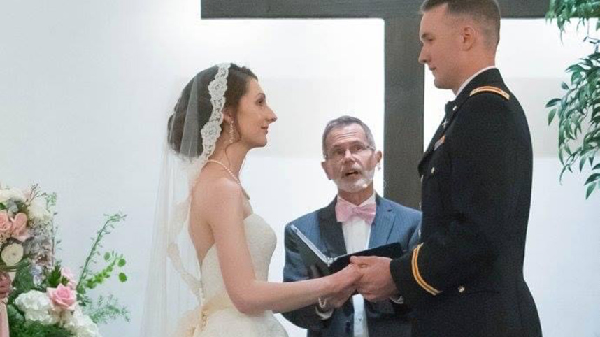 Dr. Kevin Sims officiates a wedding.