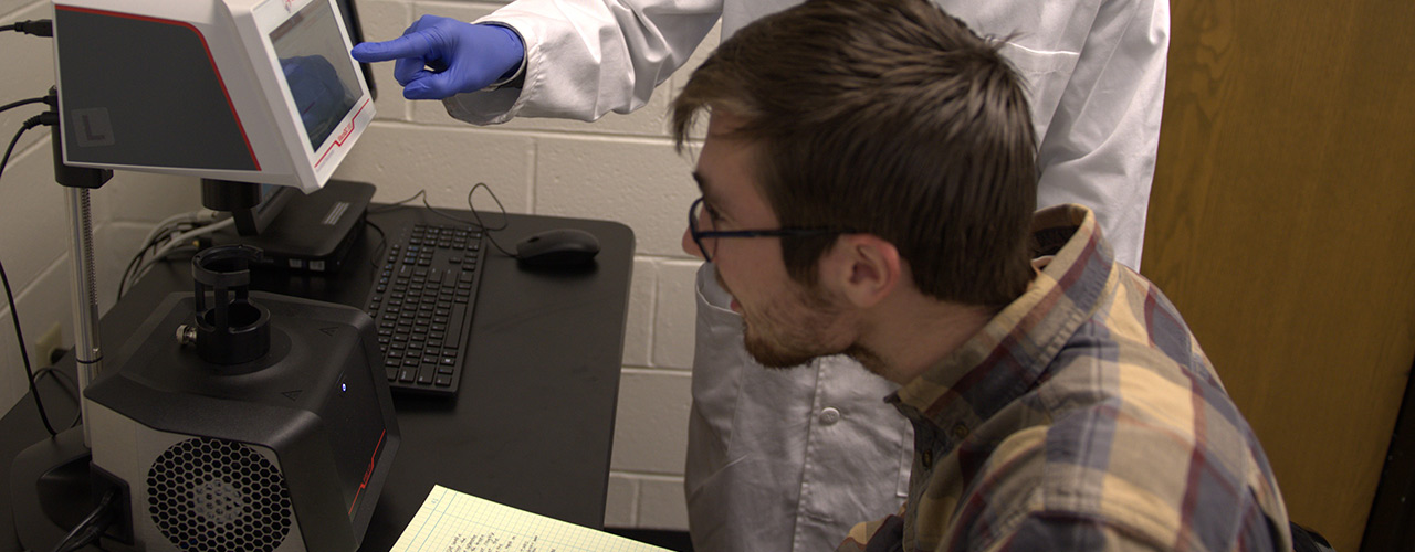 A student performs research in the nanomedicines lab.