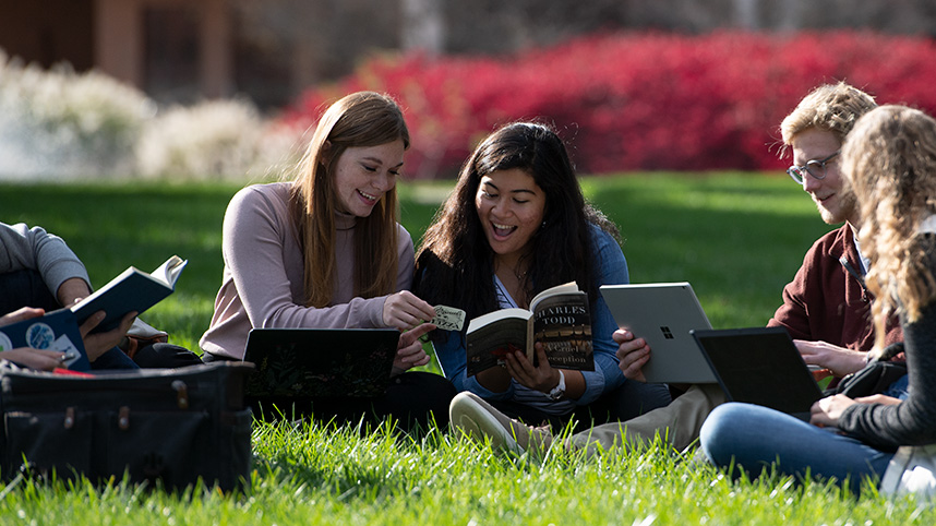 Abigail Rist studying with friends outside on campus