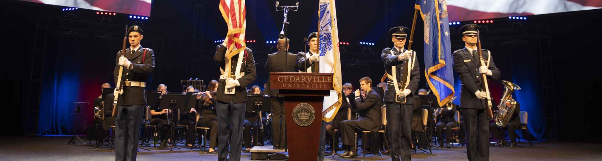 Cadets holding flags at Veterans Day chapel