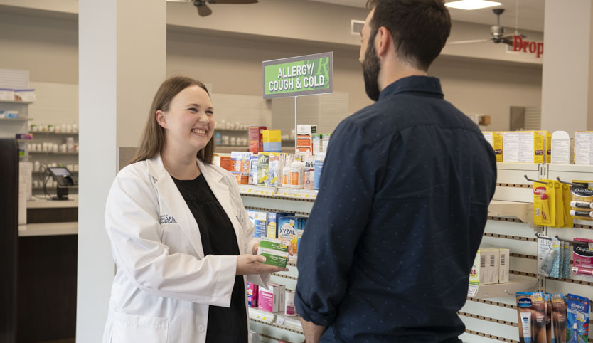 CedarCare pharmacist assisting a customer