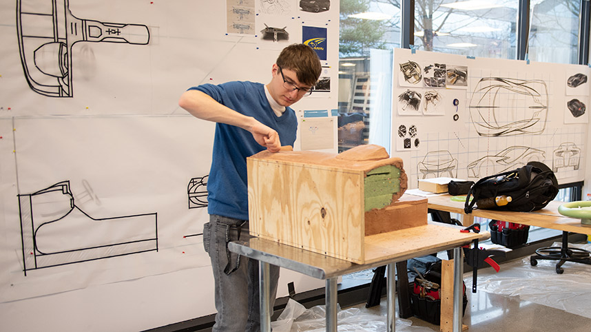 An Industrial and Innovative Design student working on a car model