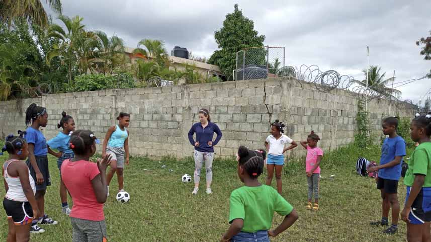 Katie Baird pictured at a soccer practice with girls from the two local schools Lafwa ran.