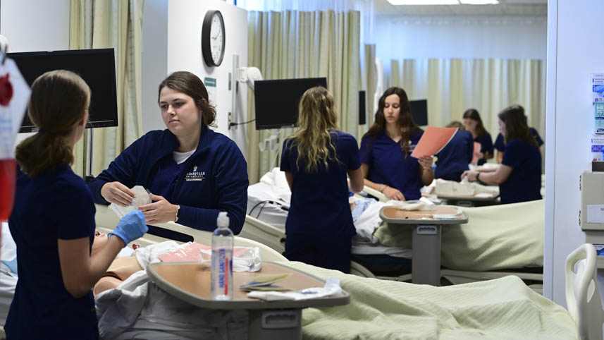 Nursing students practice their skills in the nursing SIM lab.