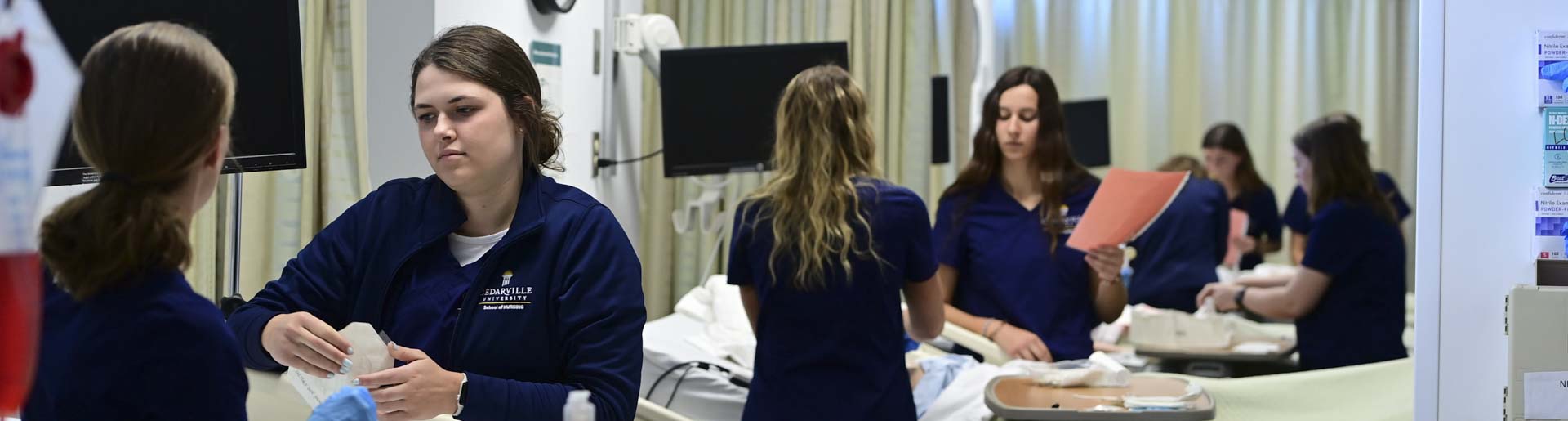 Nursing students practice their skills in the nursing SIM lab.