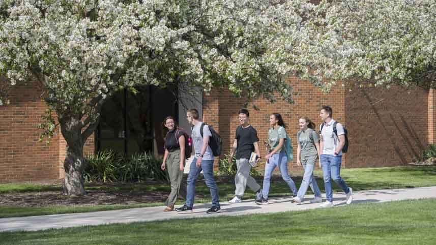 A group of students walking on campus.