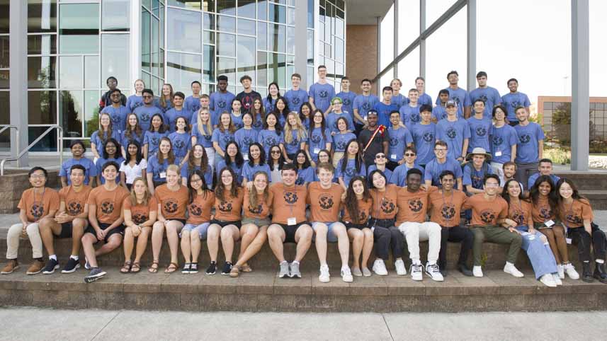 Upperclassmen international students (orange) meet new freshmen from around the world (blue).
