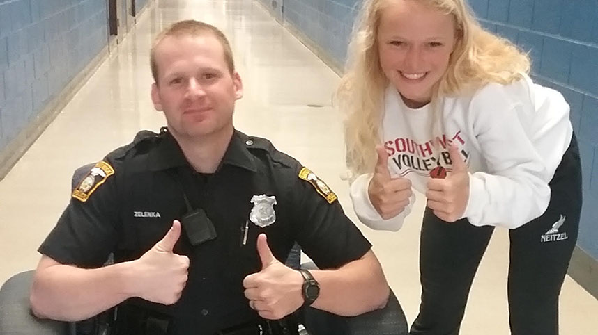 A Brunswick Police Officer interacts with a student.