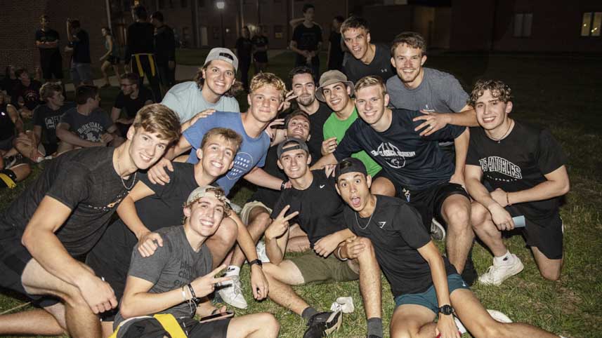 A group of male residents at a dorm event.