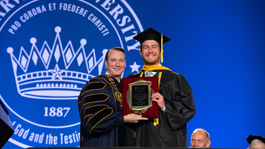 Garrett Reinhard receives the President's Trophy.