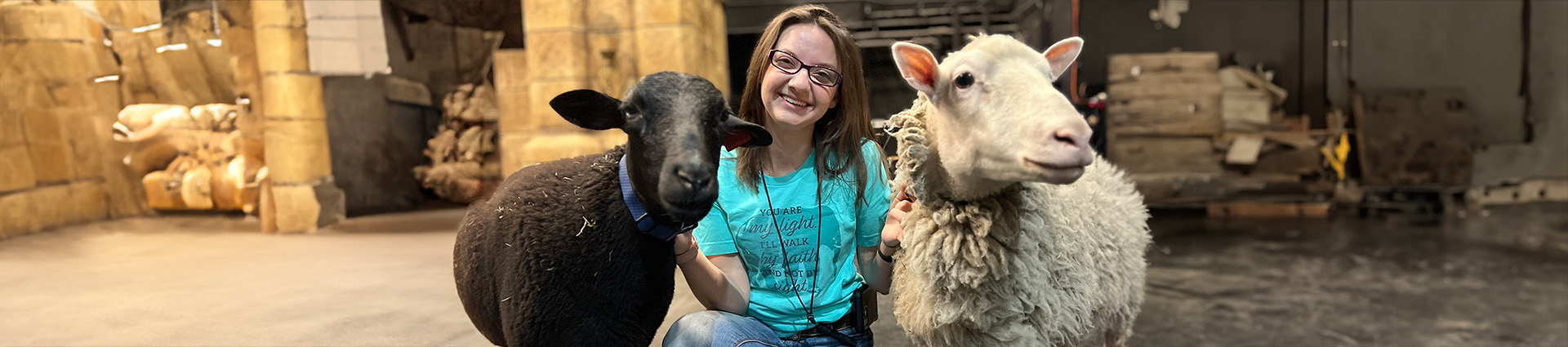 Abigail King with animals at Sight and Sound.