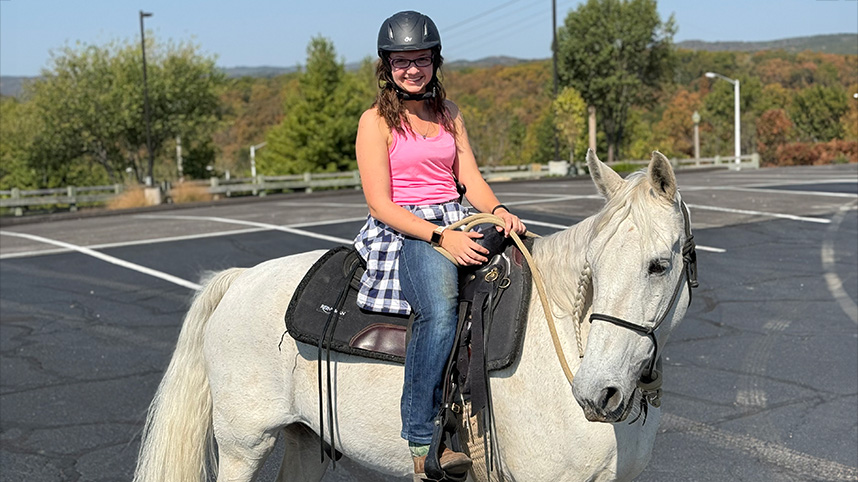 Abigail King on horseback.