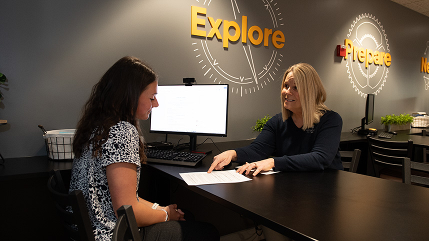 Career Services employees assist CU students with resume preparation