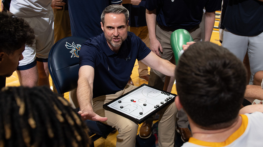 Coach Rob Jones on the sidelines with Cedarville University men's basketball team.